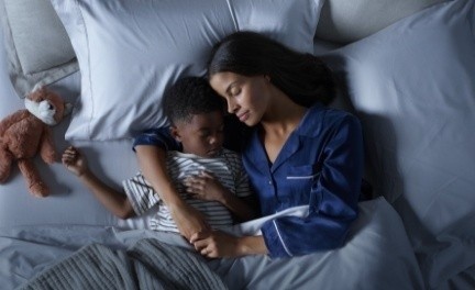 Mother and Child sleeping on a Tempur Pedic mattress