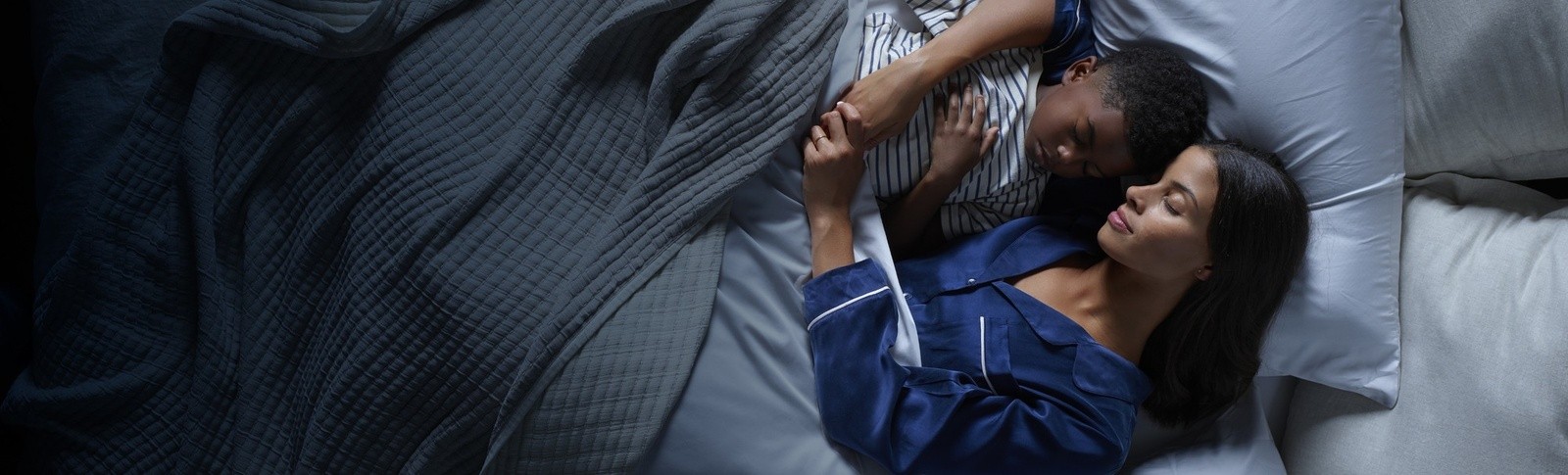 Mother and Child sleeping on a Tempur Pedic mattress